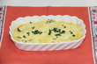 コーンスープにご飯を混ぜ、パセリとチーズを乗せて焼いたドリアの写真